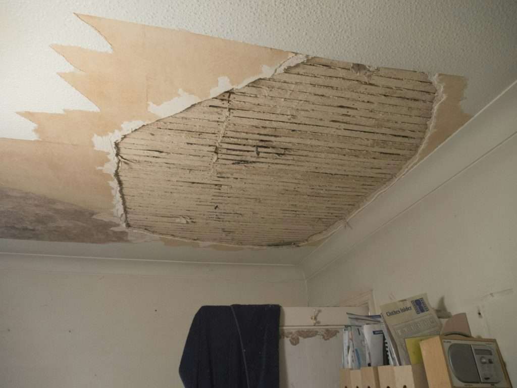 Ceiling drywall collapsed from a roof leak