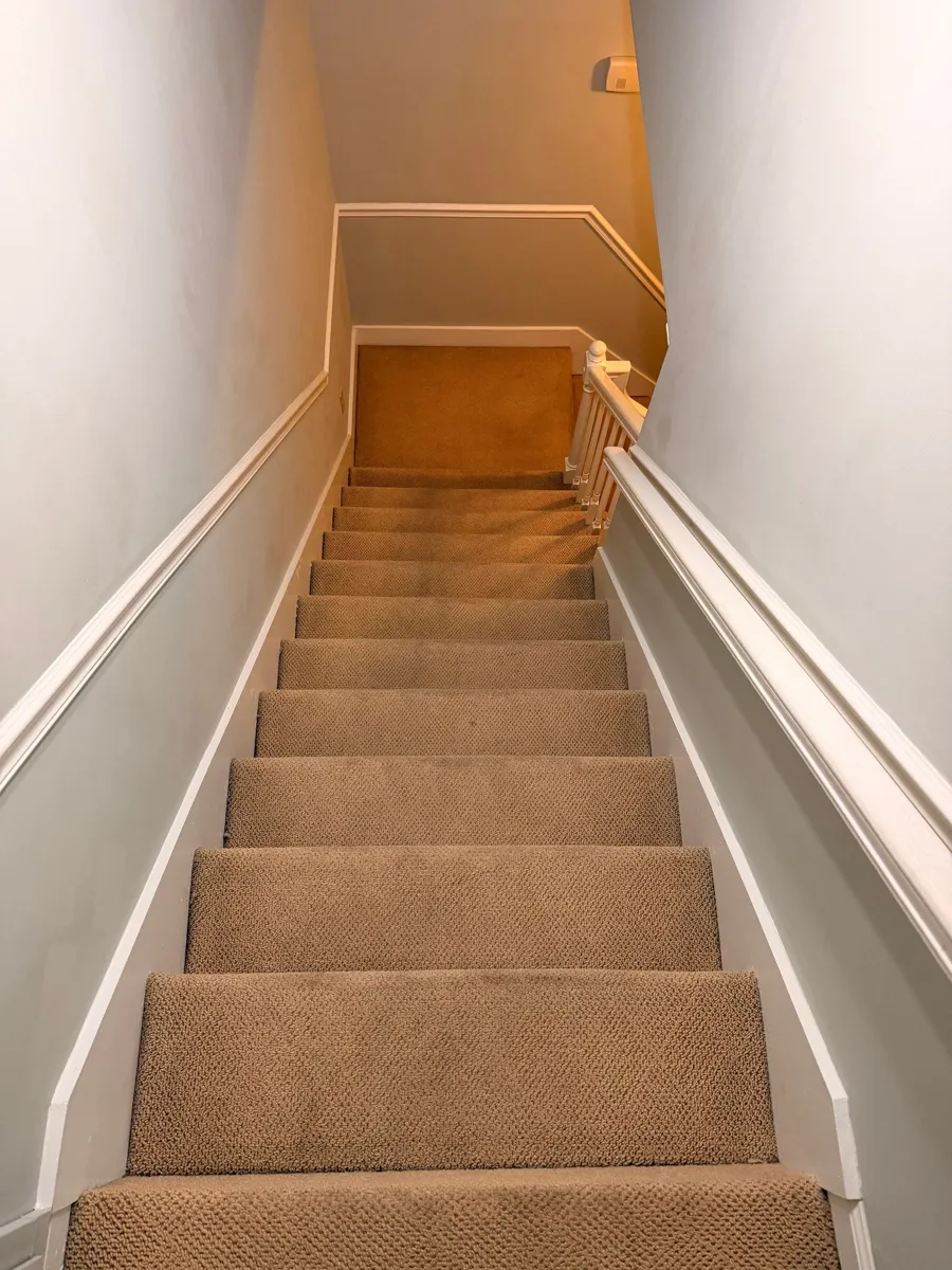 The same Tullahoma staircase after carpet cleaning, with the traffic wear removed